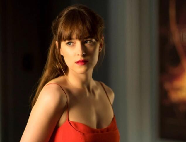 Dakota Johnson Reflects on “Mayhem” of Filming ‘Fifty Shades of Grey’ Trilogy