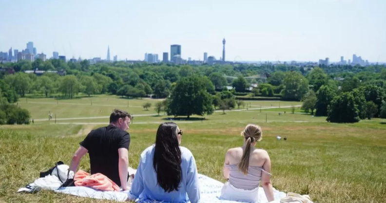 UK weather: Joint hottest day of the year as storms lash north